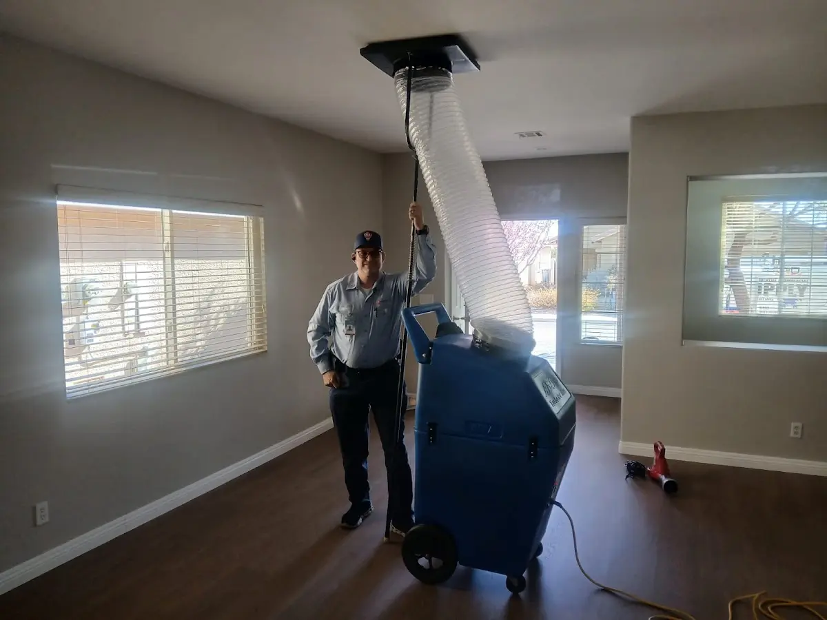 Professional Dryer Vent Cleaning work inside a Fresno home